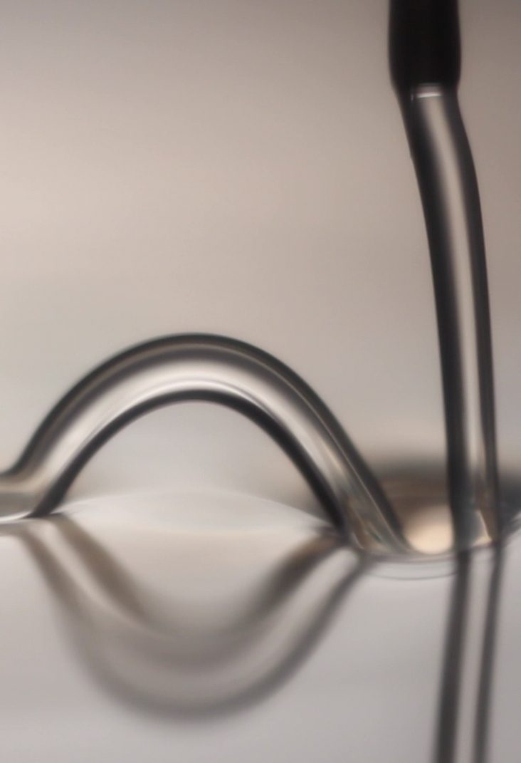 A liquid jet rebounding off a surface, captured with high-speed imaging.